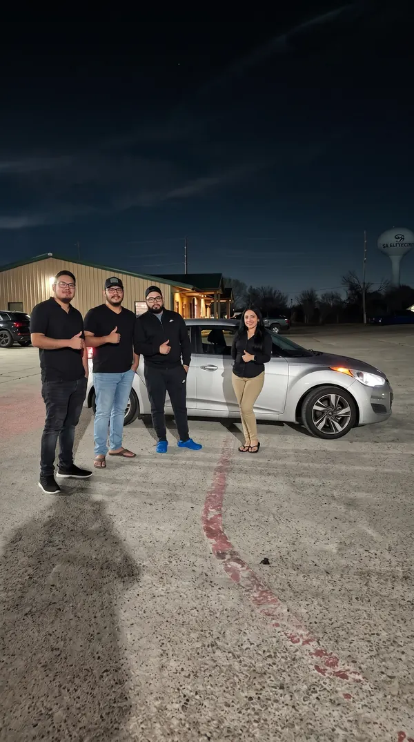 Pick & Ride Auto Sales customer with their new vehicle